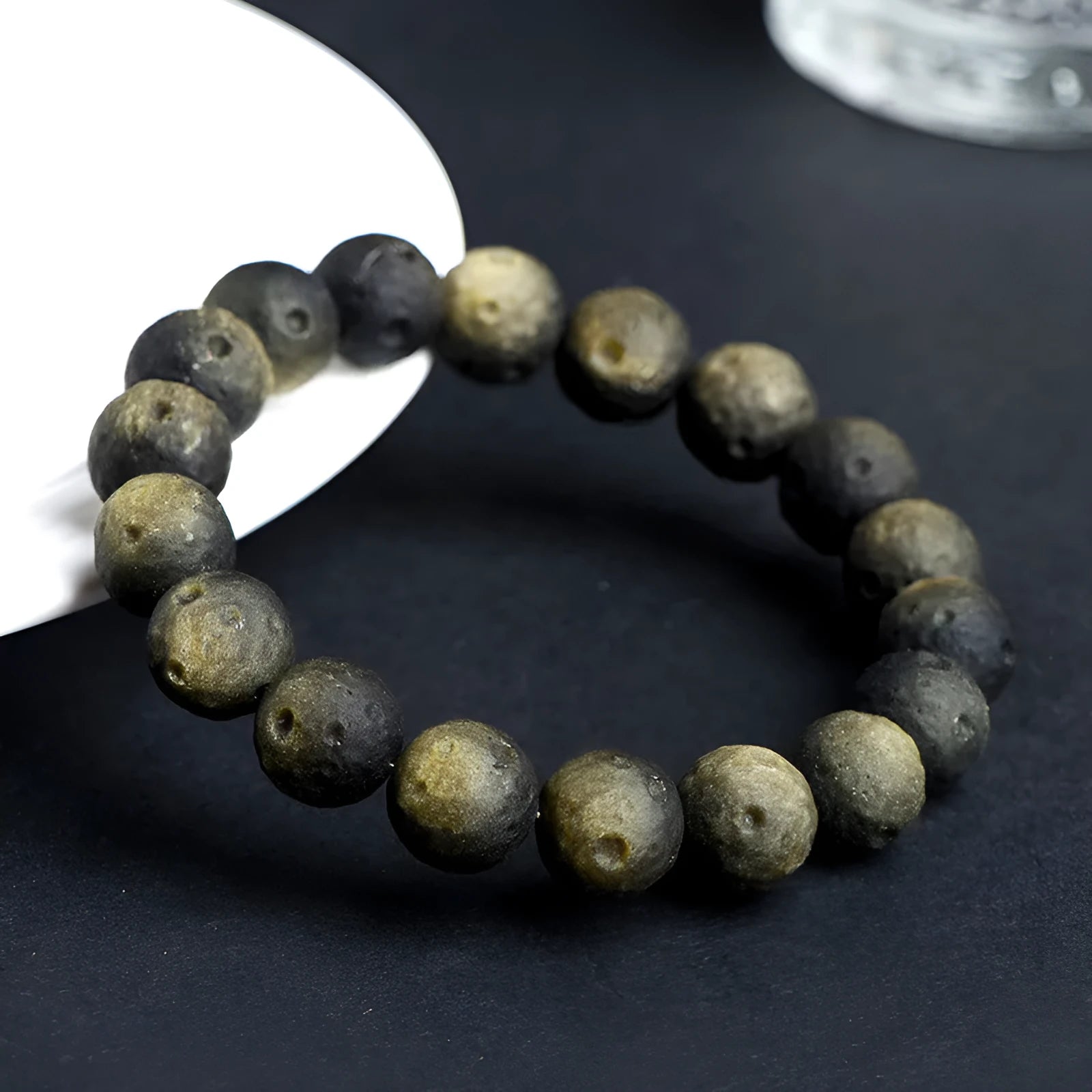 Natural obsidian crater ball bracelet with meteorite texture in silver stone and gold obsidian colour variations