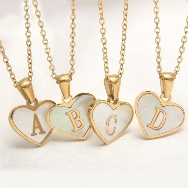 Gold-plated heart necklace with white shell centre and personalised letter pendant on 45cm chain
