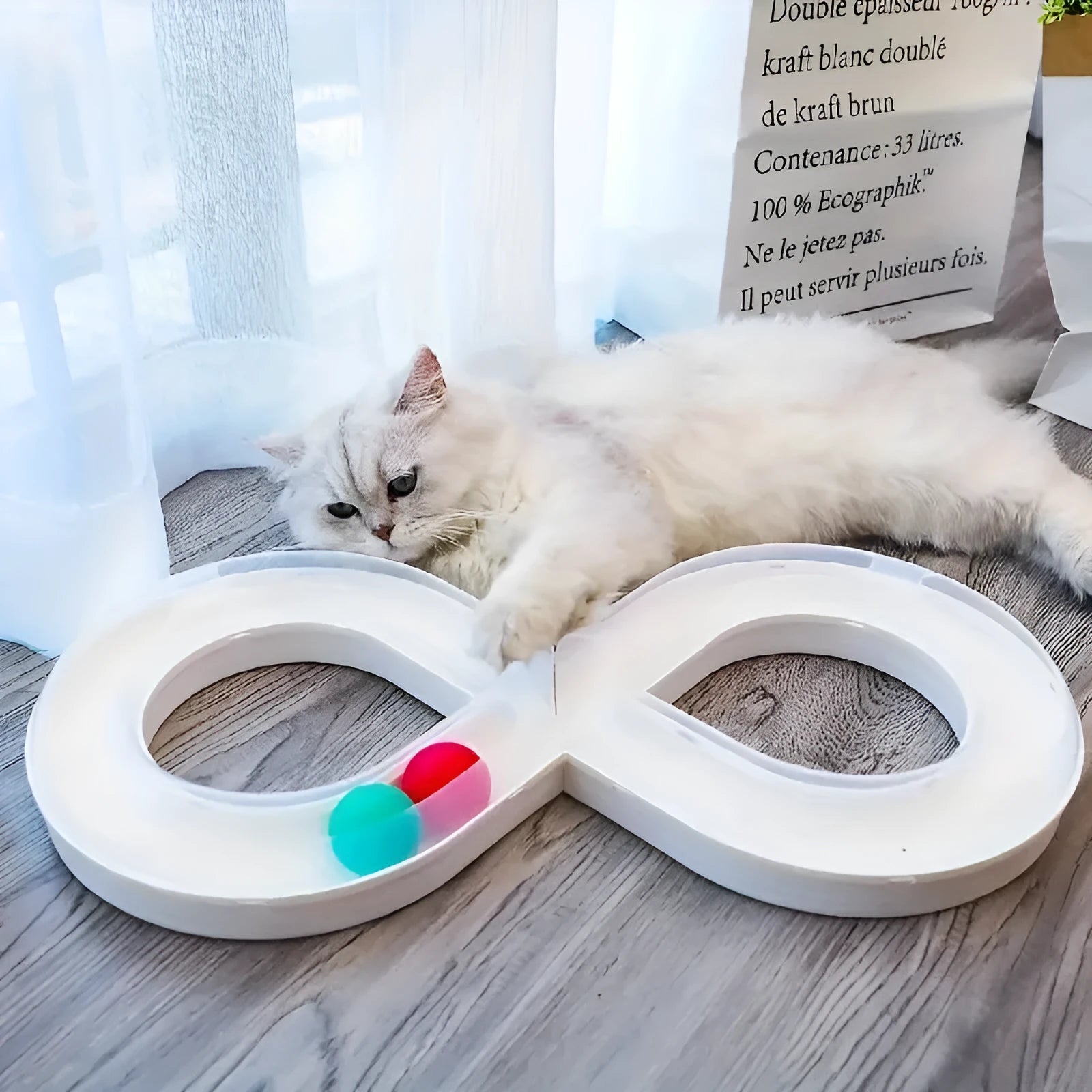 Cat toys set with rotating track ball turntable and teasing stick on white background