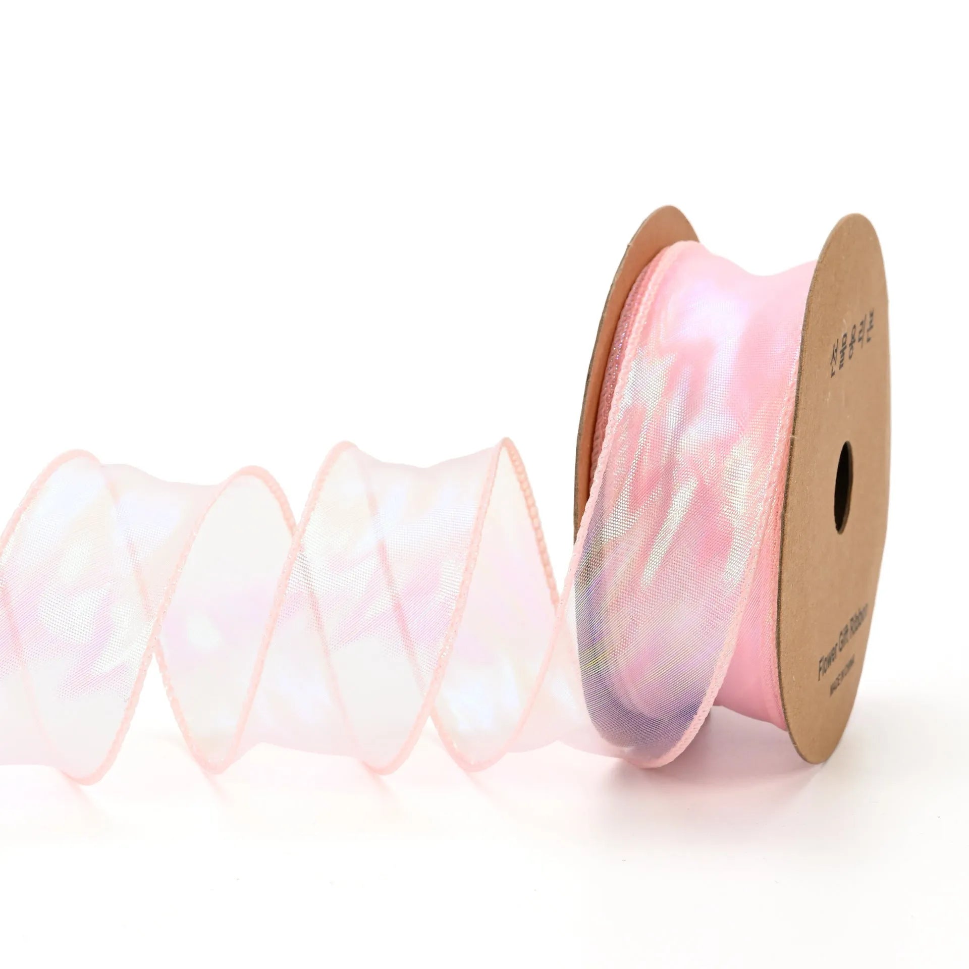 Roll of 4cm wide colourful mesh ribbon with fishtail yarn floral wave design.