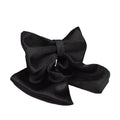 Dog wearing cloth collar and chest-strap vest harness with matching leash and decorative bow attached