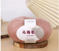 Ball of mohair yarn for DIY scarf knitting in one of 34 colours, including white, pink, blue, and green.