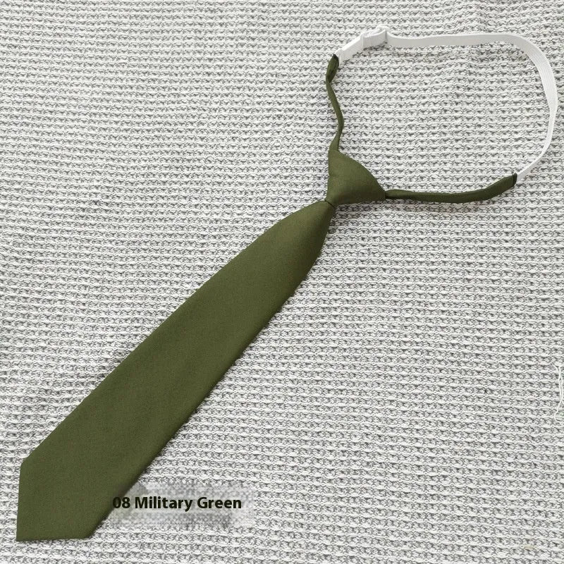 A navy blue cotton men's bow tie with an arrow style design on a white background.