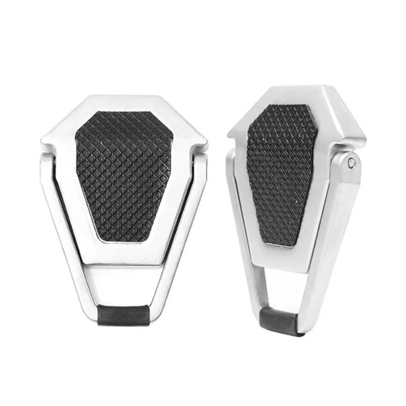 Silver foldable aluminium laptop bracket shown next to 3M adhesive glue on desktop