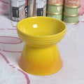 White ceramic pet bowl with a high foot neck and slanted rim for cat or dog feeding