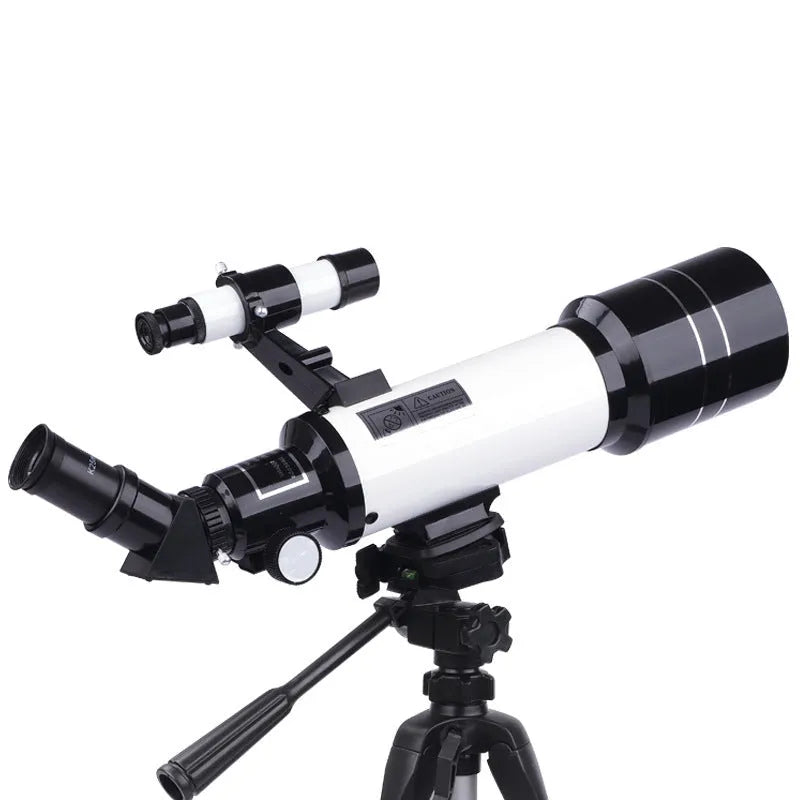 Dark blue children's astronomical telescope with adjustable magnification on a tripod, next to a mobile phone holder accessory.