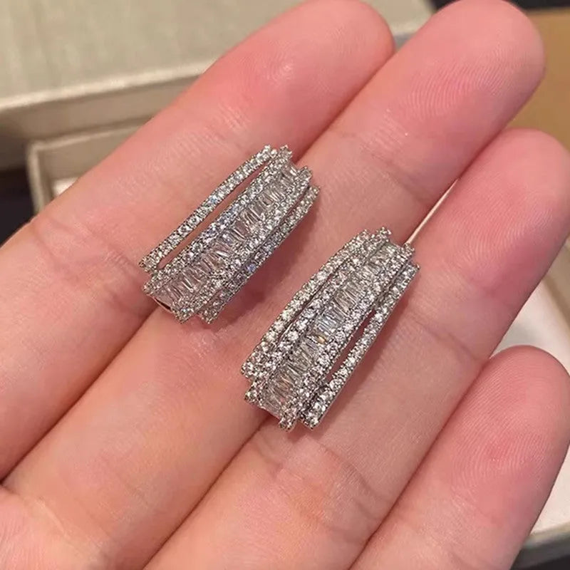 Women's geometry-shaped stud earrings with zircon detailing in white gold colour