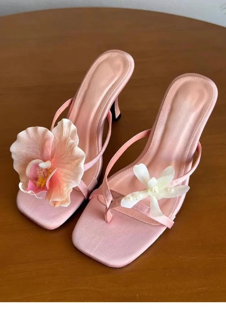 Handmade women's asymmetric flower sandals with high heel and square toe in black, green, pink, or white
