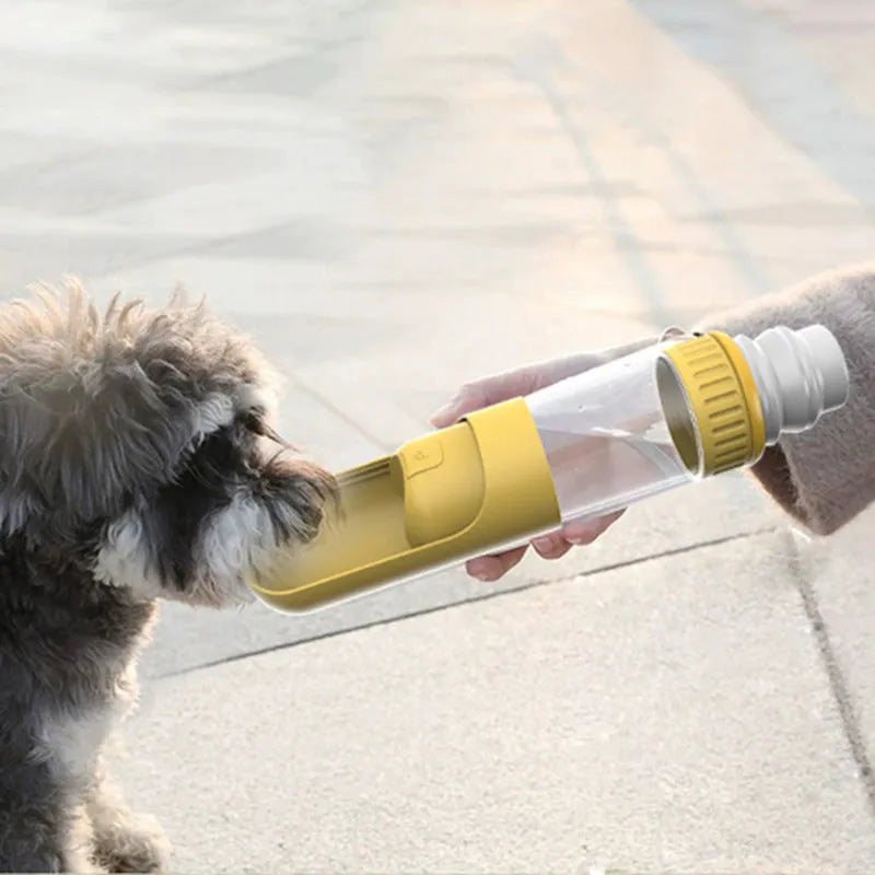 Dark blue portable dog water bottle with an attached drinking bowl, shown with leak-proof cap.