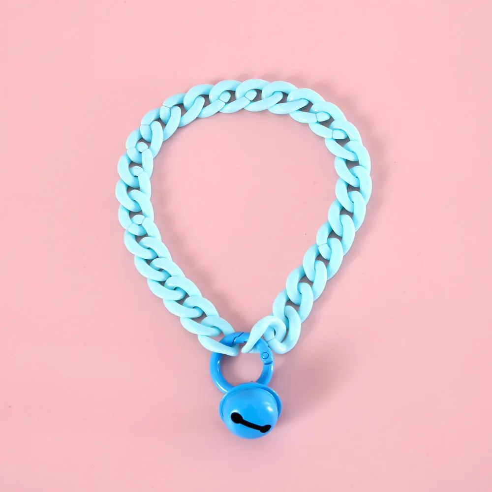 Adjustable plastic pet collar in macaron candy colours with chain detailing, shown with a buckle.