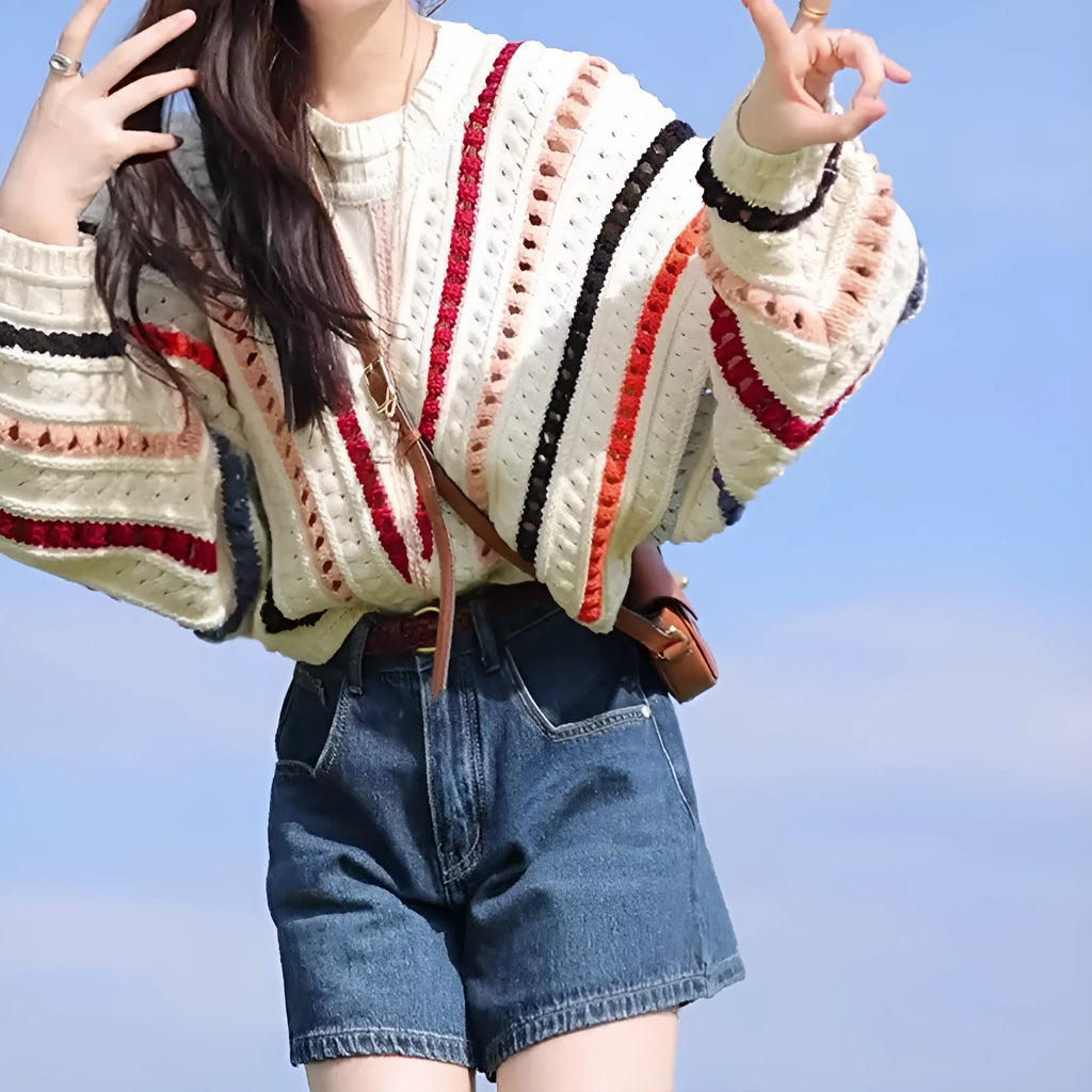 Retro rainbow striped loose sweater with batwing sleeves and a round neck.
