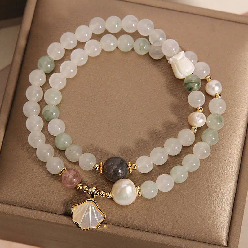 Women's Tianshan emerald green crystal bracelet with gold-plated apricot leaf pendant and rhinestones.