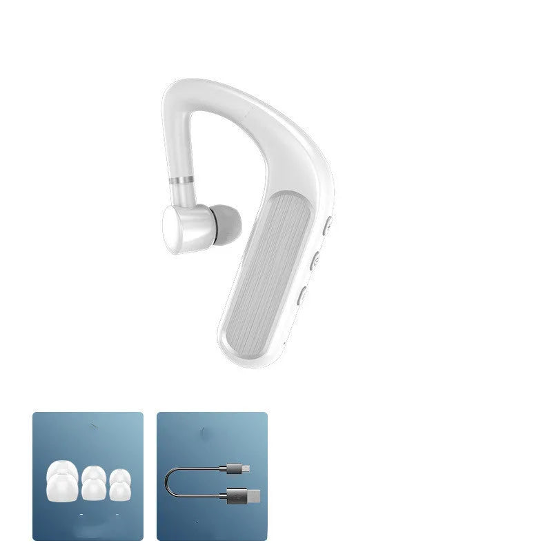 Black Bluetooth earphones with a charging warehouse case and silicone ear caps on a table.