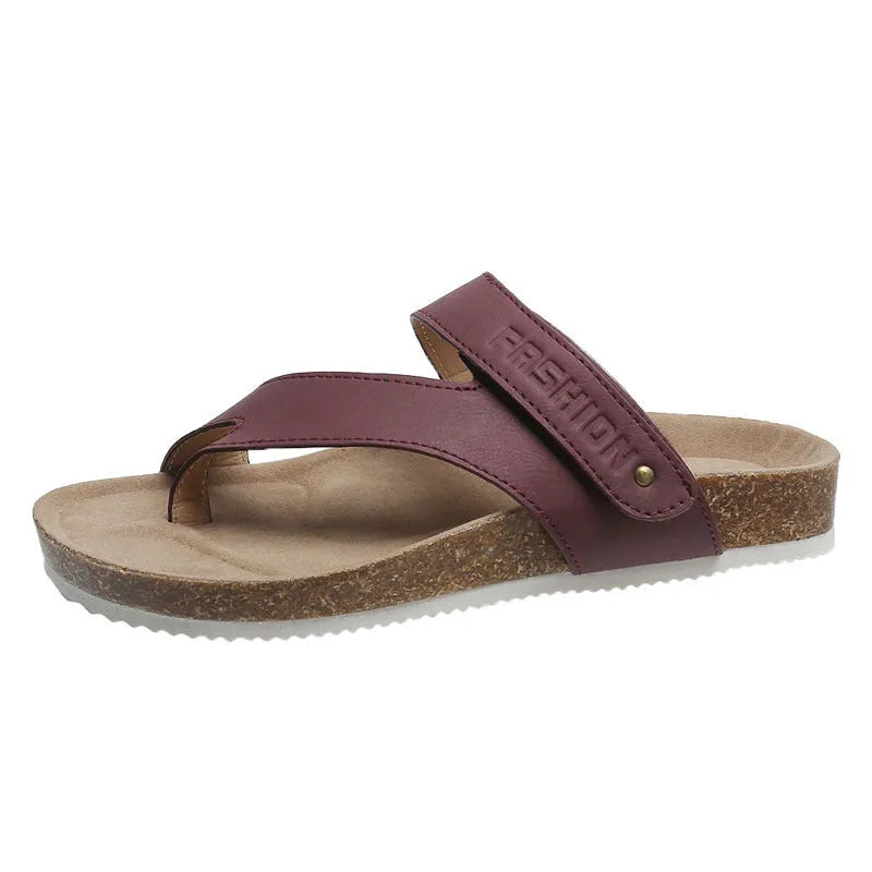 Blue thick-soled flat toe ring flip-flops on a white background.