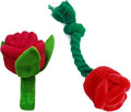Plush pink rose flower dog chew toy with green leaf and a squeaker inside.