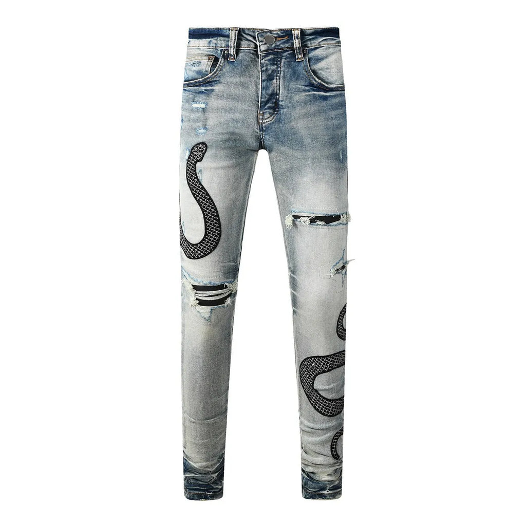 Blue distressed street fashion skinny jeans with a button fly and tight leg fit.