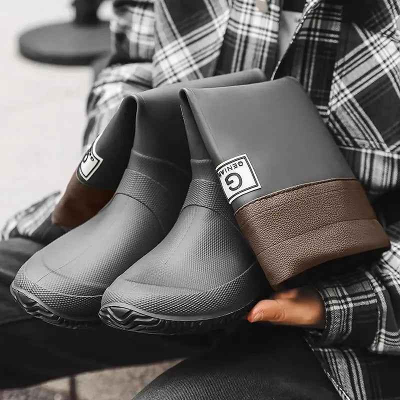 Unisex rain boots in black brown gray green with plastic upper, flat heel, round toe and leather stitching