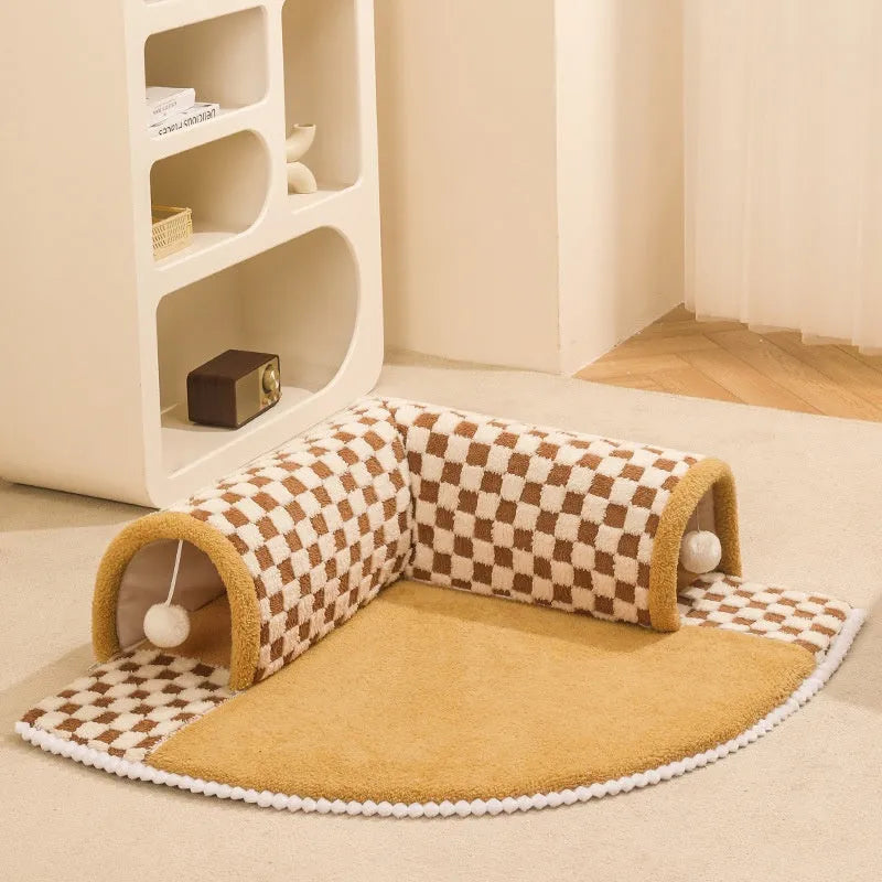 Brown plush plaid cat tunnel bed with central mat showing collapsible tube design