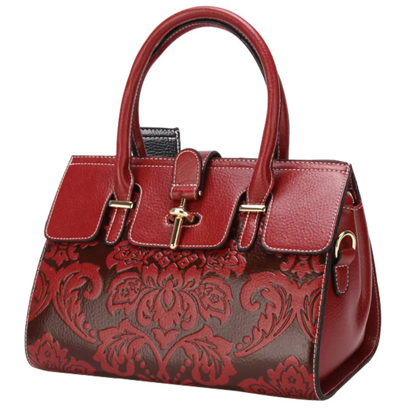 Women's vintage leather crossbody bag in red with embossing and multiple internal compartments