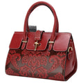 Women's vintage leather crossbody bag in red with embossing and multiple internal compartments