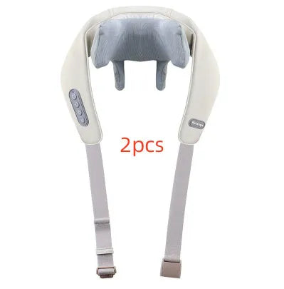Beige neck massage pillow with six massage heads and wireless remote control on a table