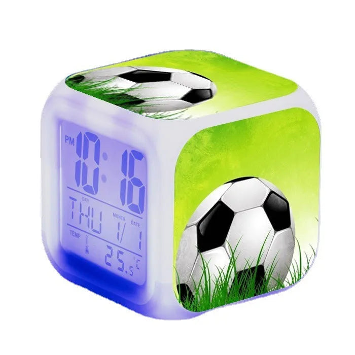 Square cartoon football pattern mute alarm clock for students and children on a desk.