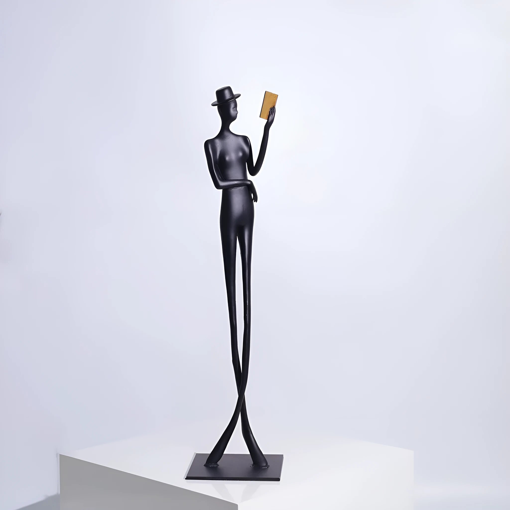 Black cast aluminium reading woman desktop sculpture modern minimalist design 51cm tall
