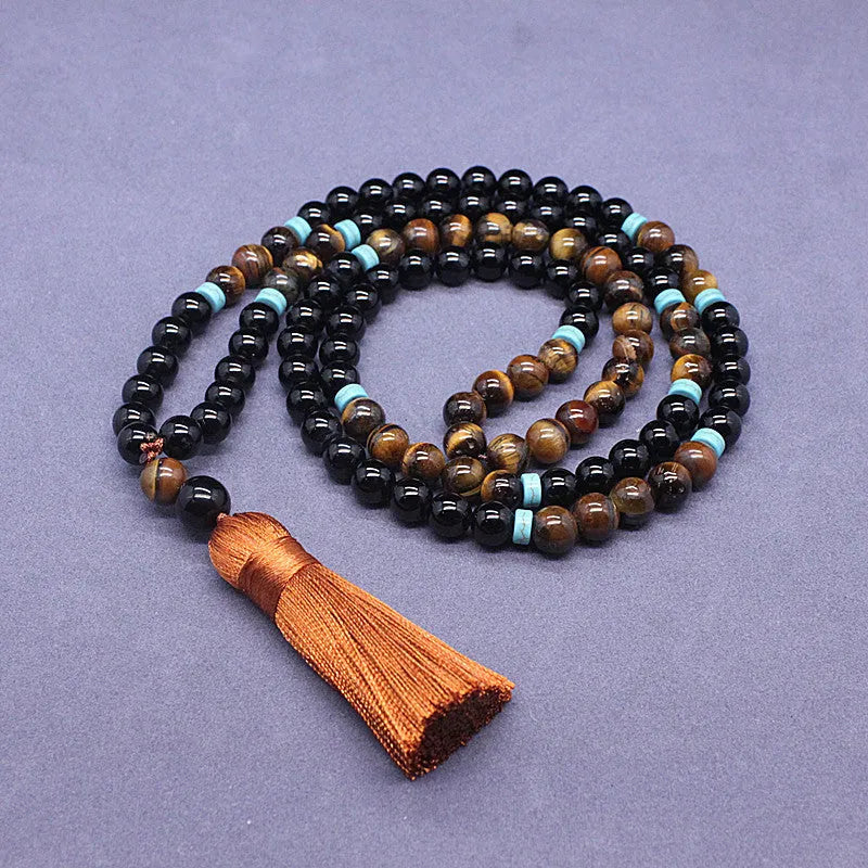 Black agate and tiger's eye geometric beaded bracelet and necklace set.