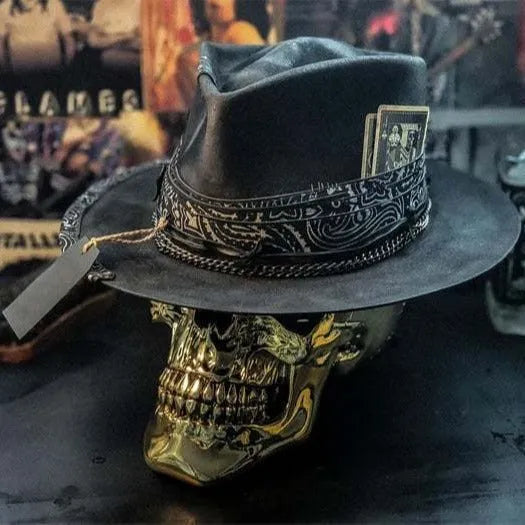 Handmade black wool felt skull hat with conical crown and textured denim-like finish.