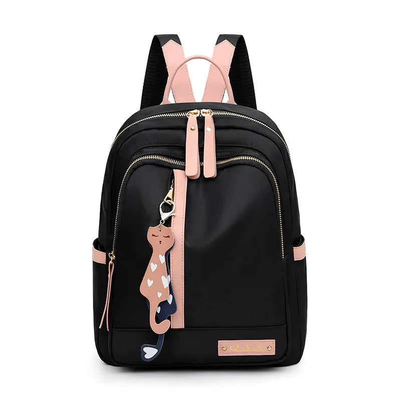 Black and pink casual nylon backpack with double straps, soft handle, and external pocket.