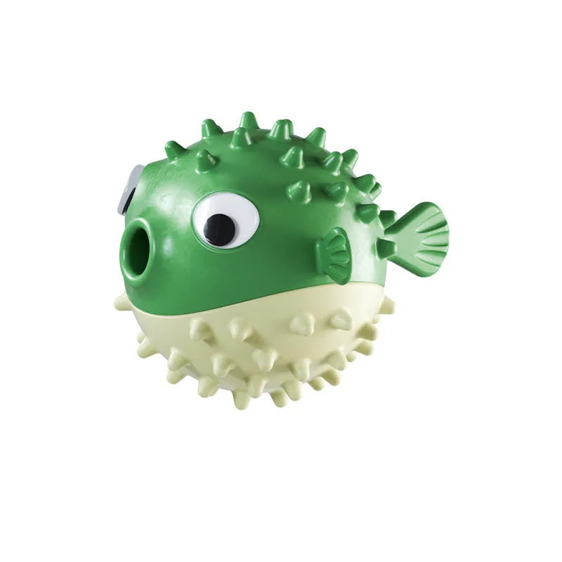 Green fish-shaped interactive dog chew toy with textured surface for treat dispensing