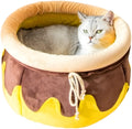 Pink honey pot-shaped enclosed cat sofa bed with a soft fabric exterior and a removable cushion.