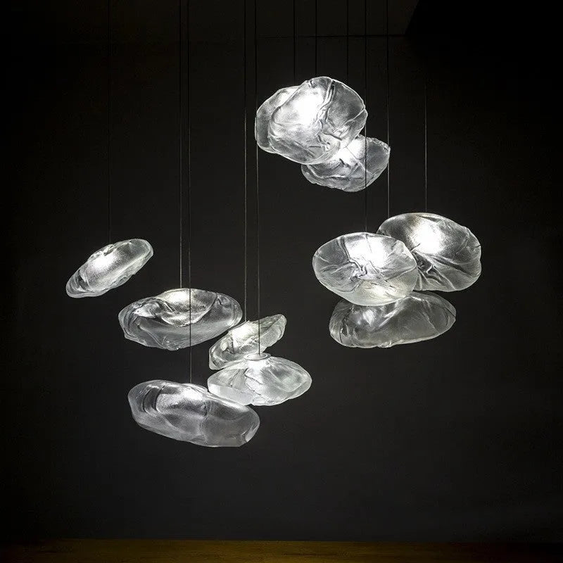 Postmodern style fabric chandelier with glass shade, shown in amber, clear, and smoke grey colours.