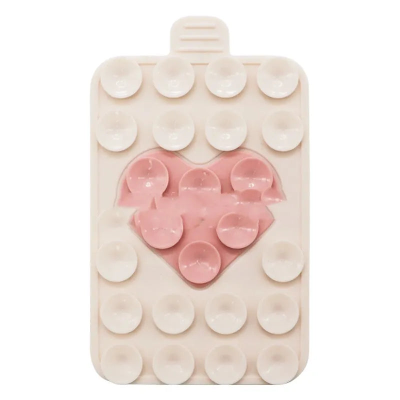 Double sided silicone suction cup phone case holder in gray white, showing hot pressed construction for universal fit on smooth surfaces