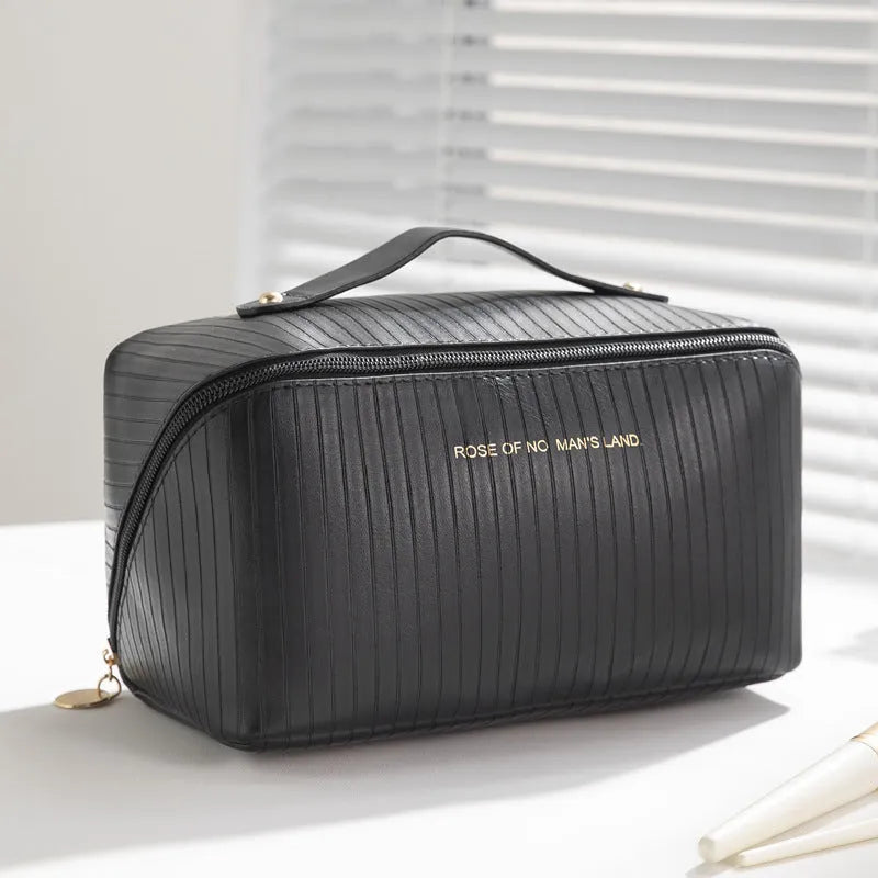 Vertical pattern pillow makeup bag in beige, black, brown, grey, or pink, showing cubic 22.5cm shape.