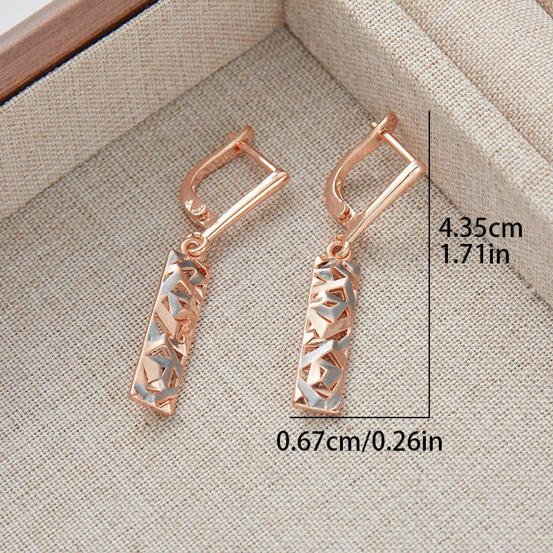 A pair of rectangular two-tone hollow stud earrings with an electroplated picture-style finish.