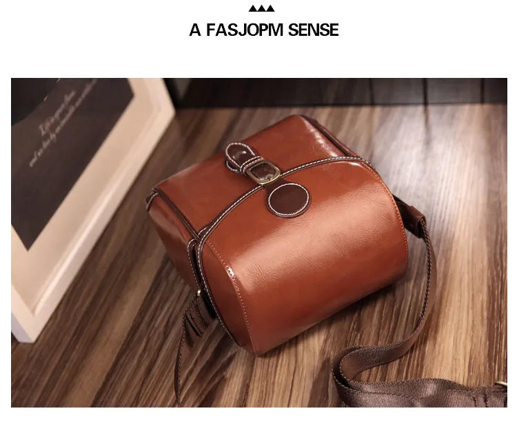 Single shoulder SLR camera liner bag in PU leather with polyester cotton insert, shown in reddish brown