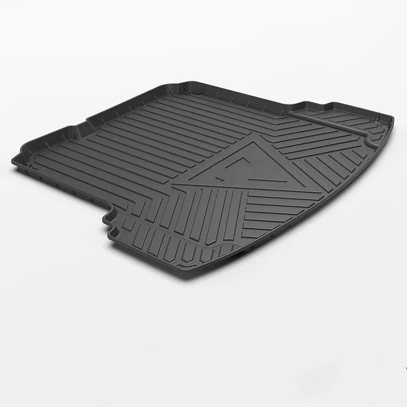 Black TPE car boot liner mat with a carbon fibre pattern texture, laid flat.