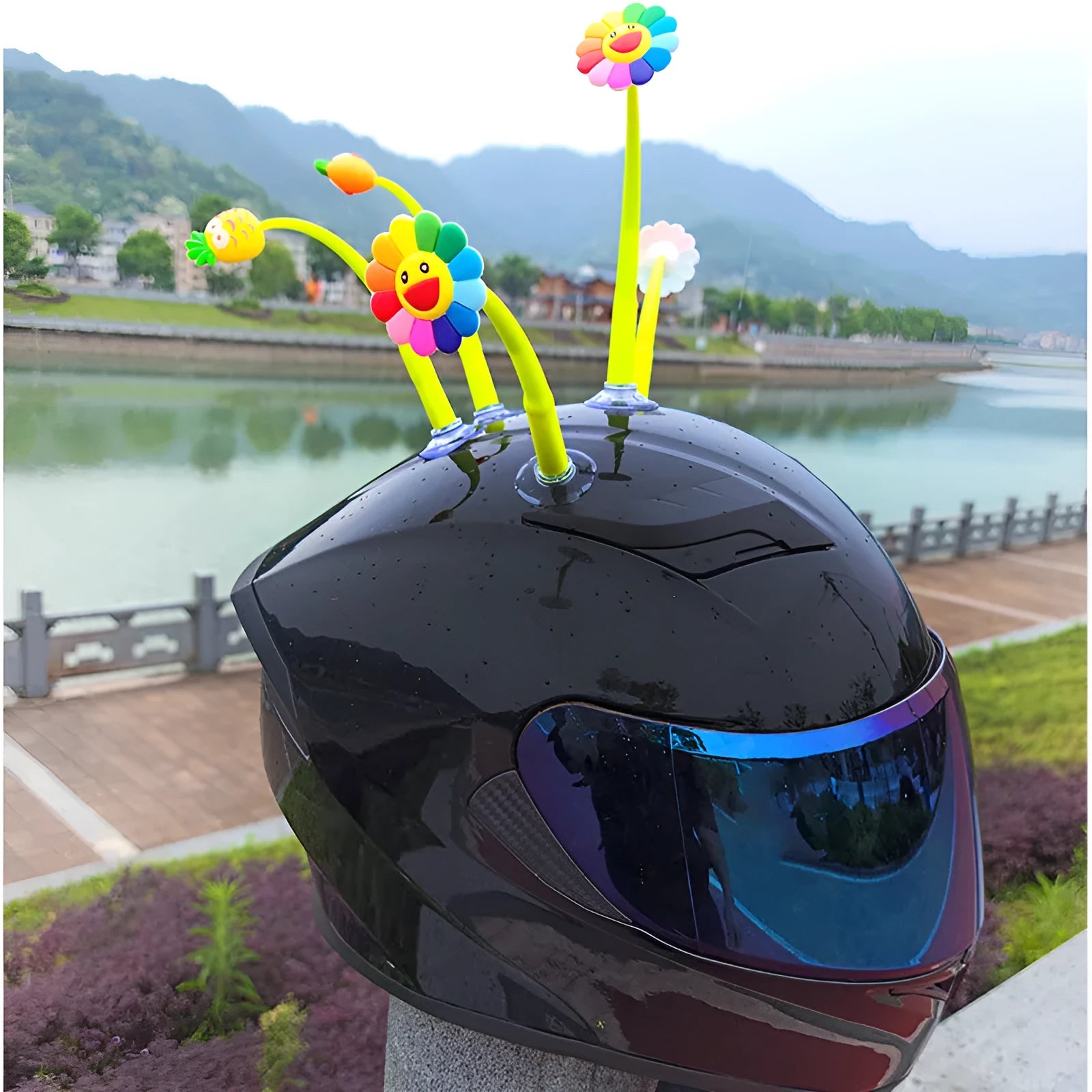 Yellow silicone sunflower decoration with suction cup base for helmets and dashboards.