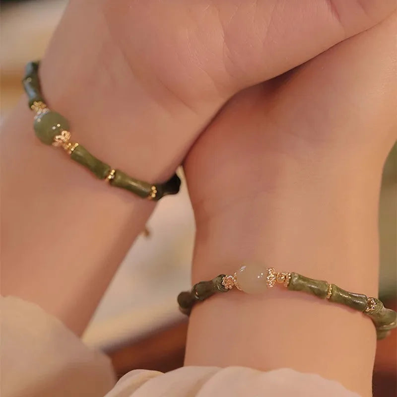 Women's simple geometric Hetian jade bangle bracelet in dark green and light colour options.