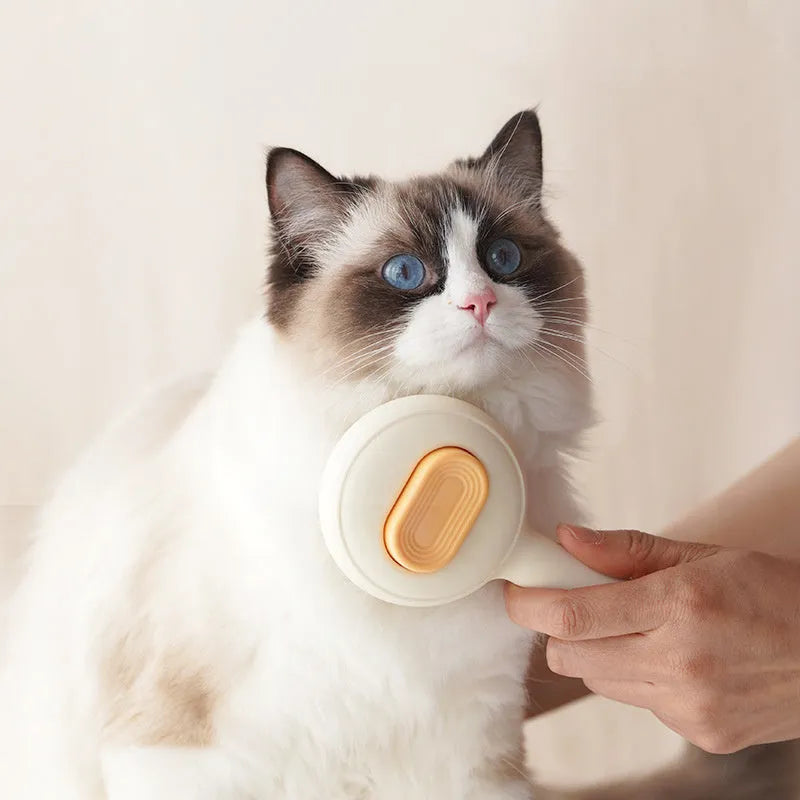 Stainless steel cat grooming brush with non-slip plastic handle in green colour