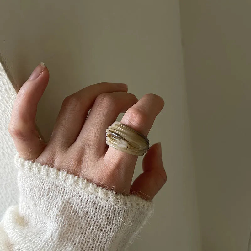 Chinese style geometric resin ring in irregular wide band shape showing three colour options