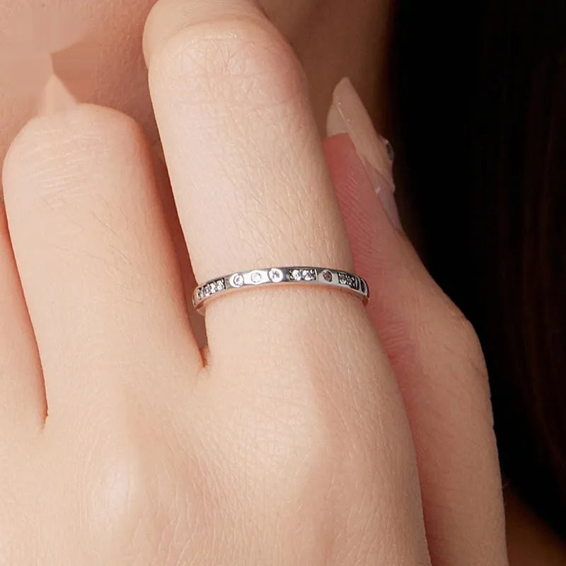 Oxidised black silver 'I Love You' moss code ring on a simple band for women.