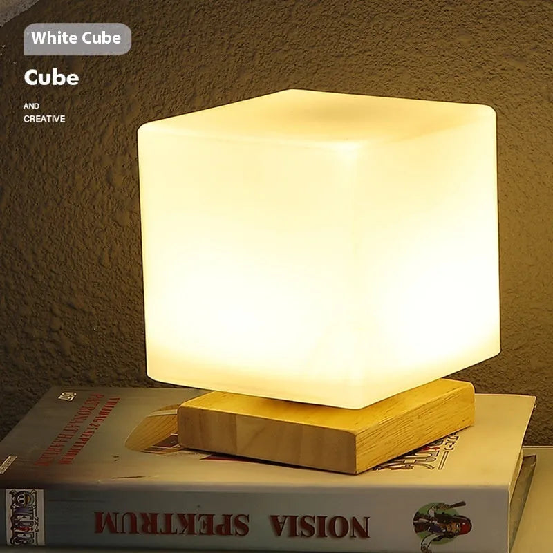 Nordic solid wood base USB table lamp in a choice of cube, column, cylinder, or ball shapes with touch dimming.