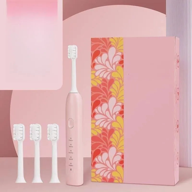 Yellow USB rechargeable adult electric toothbrush with small duck design and soft bristles.