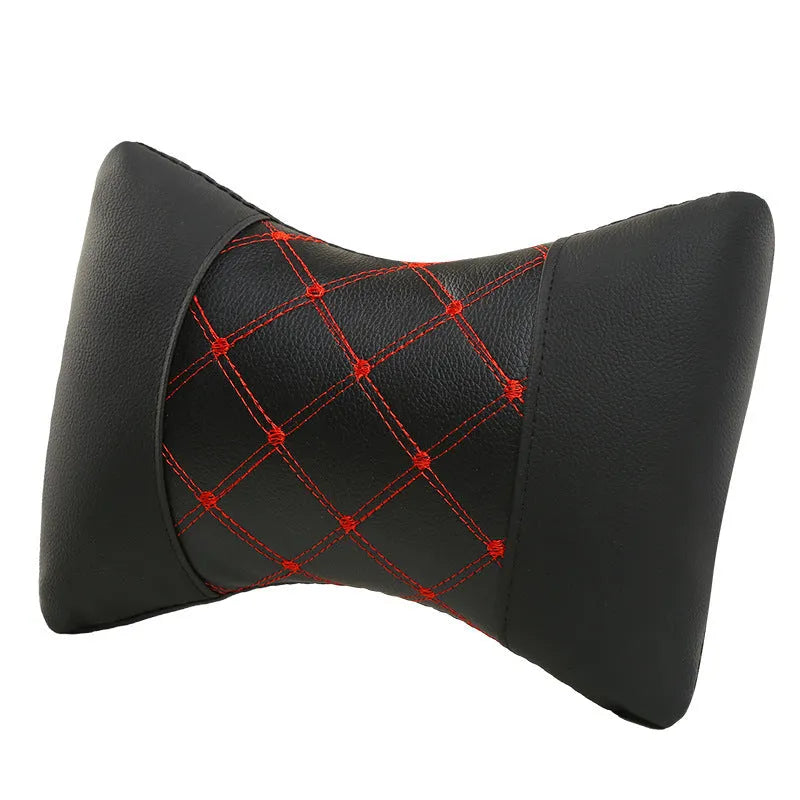 Black quilted diamond pattern car headrest pillow for cervical neck support.