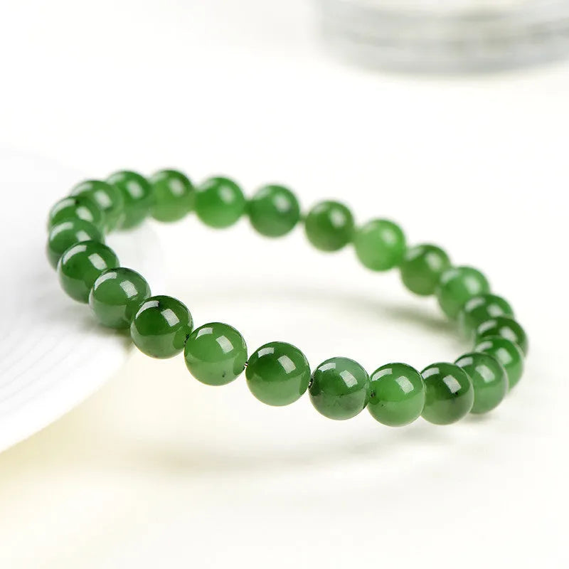 Polished natural jasper bead bracelet in Hetian jade, showing multiple bead size options on a wrist.