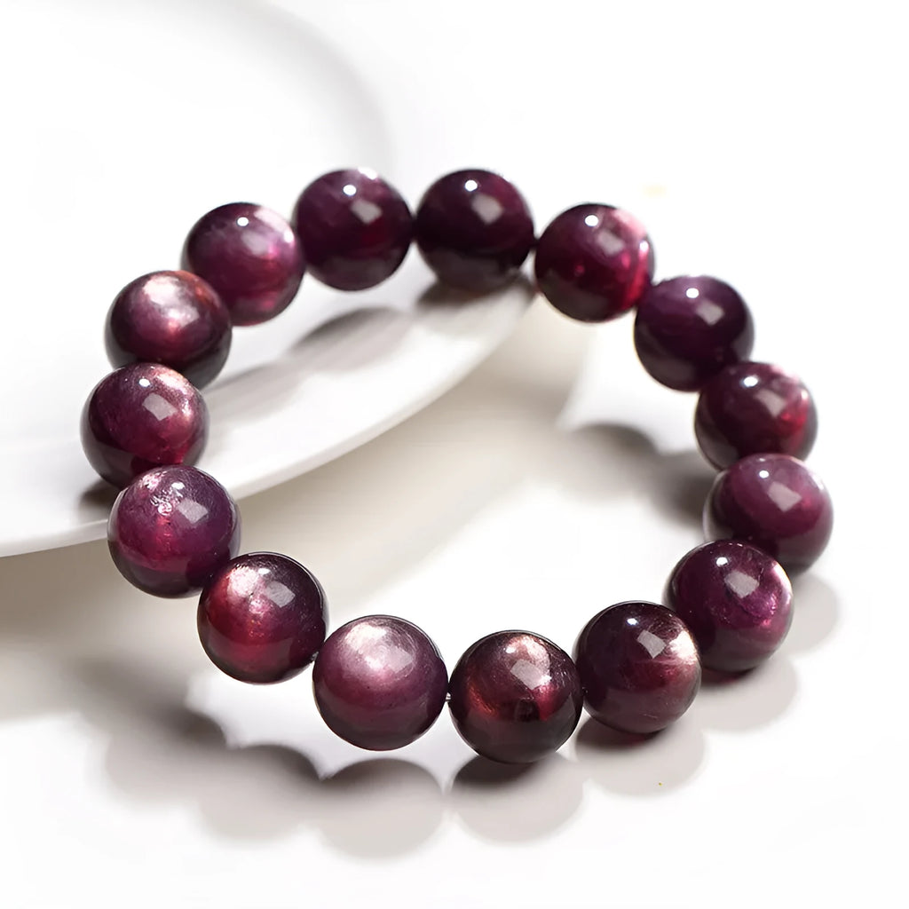 Purple lepidolite crystal round bead bracelet with polished finish and adjustable closure on a wrist.