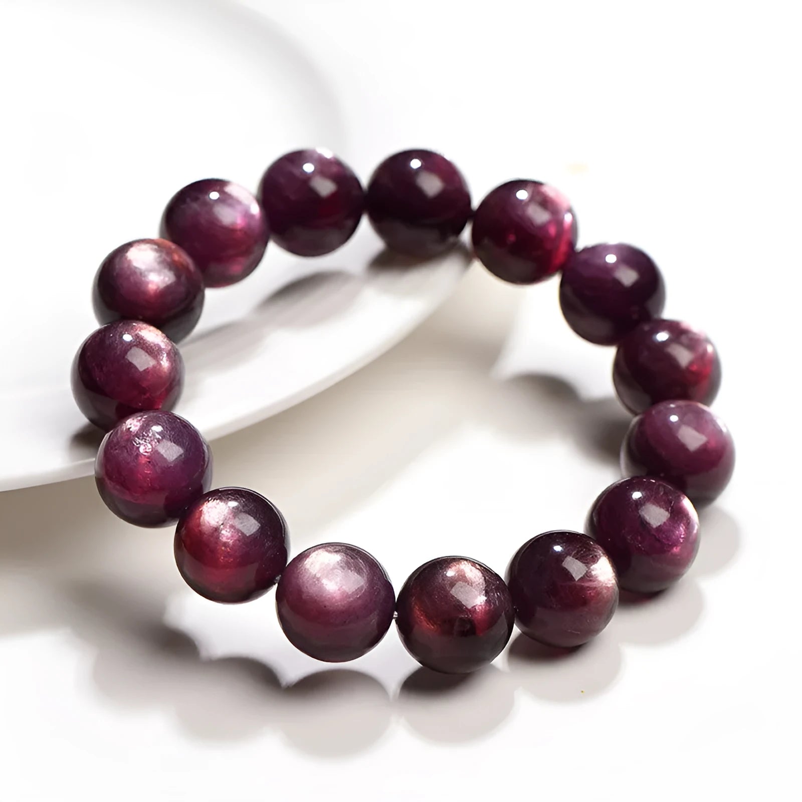 Purple lepidolite crystal round bead bracelet with polished finish and adjustable closure on a wrist.