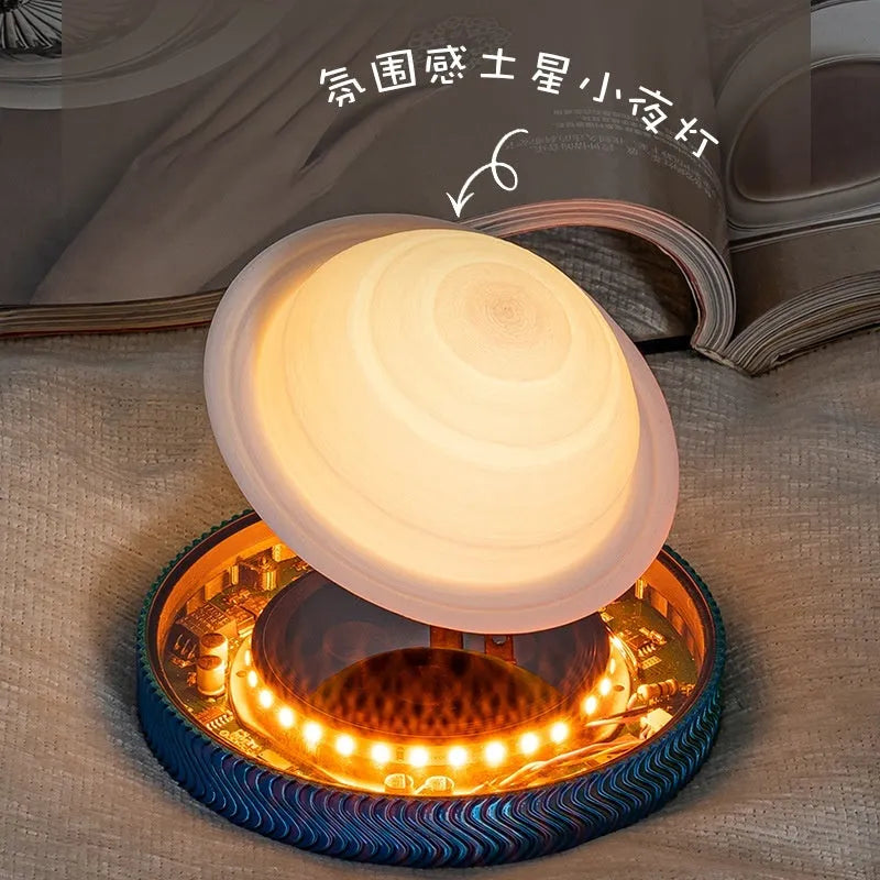 Small magnetic suspension night lamp in a choice of 3D-printed Moon, Saturn, or Bulb shapes on a dark background.